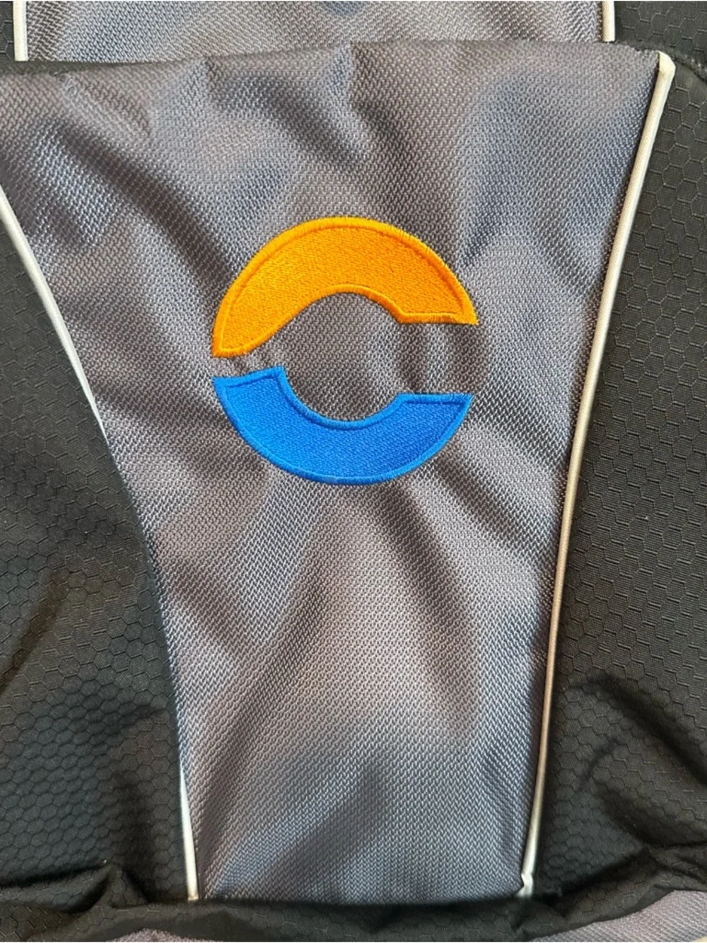 High Sierra Black and Gray Backpack with Blue and Orange Logo